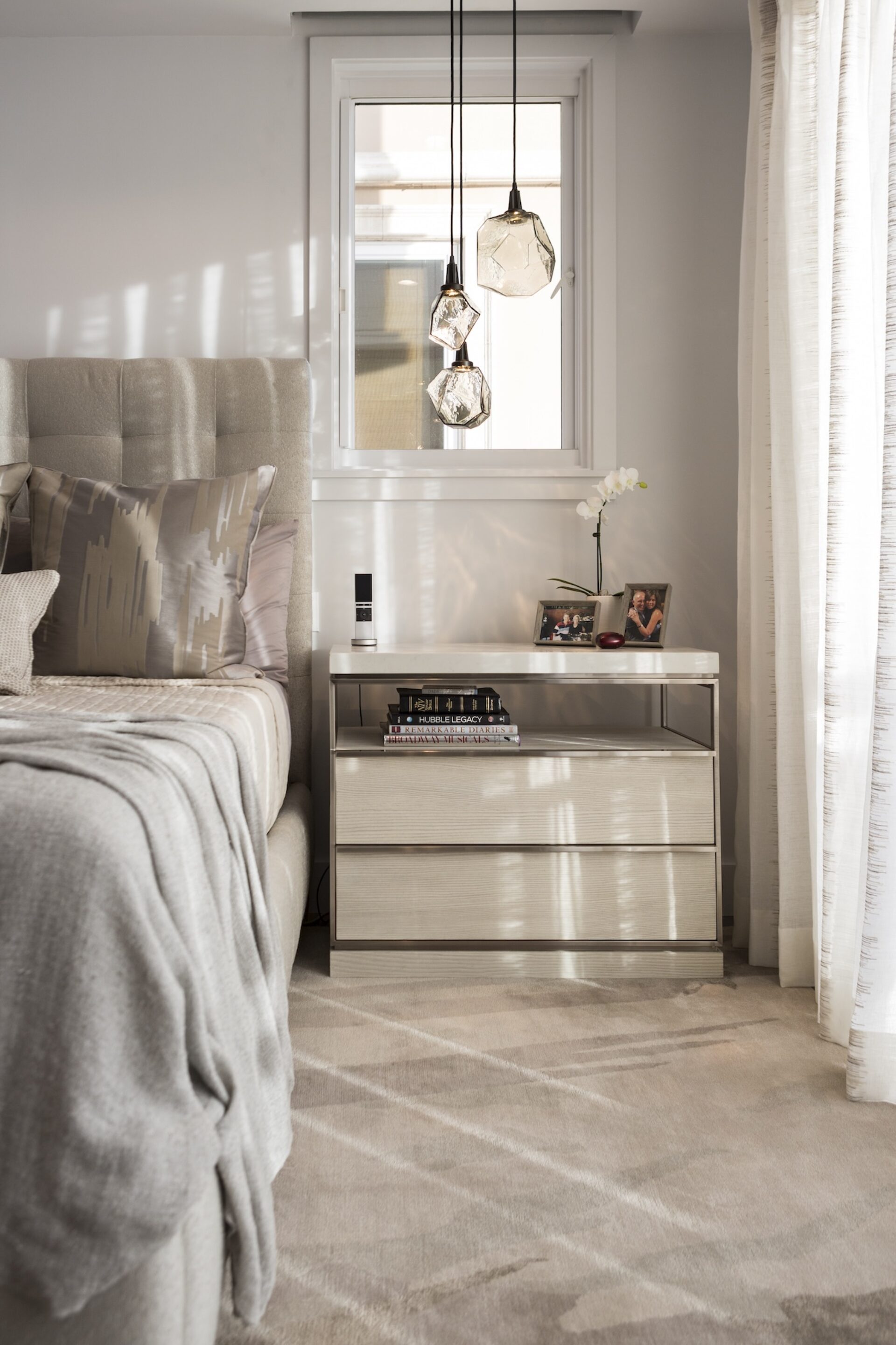 Bedroom Nightstand Detail With Hanging Lights