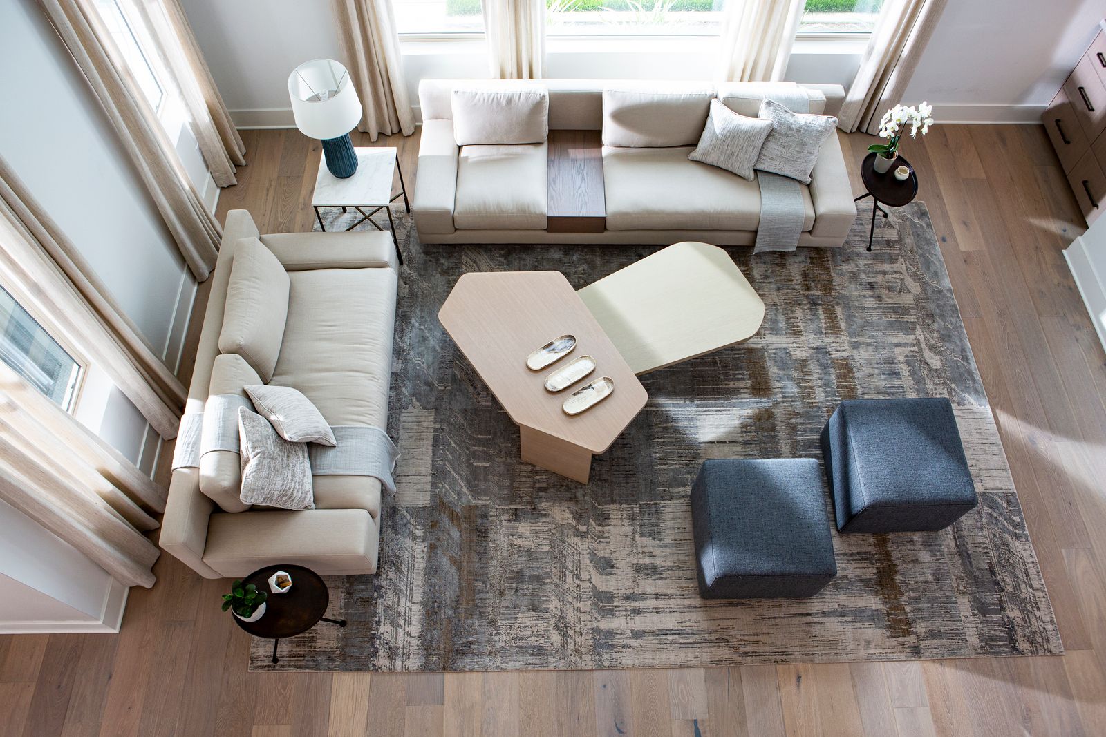 Aerial View Of Living Room With Ottomans And Coffee Table